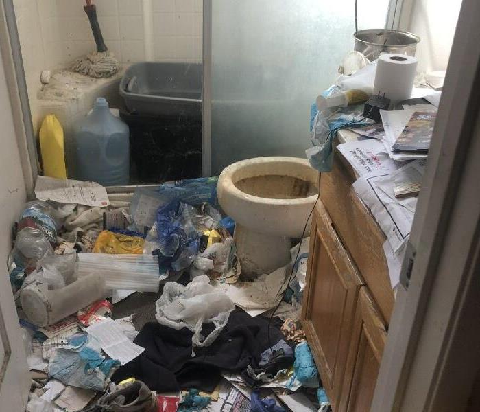  A very destroyed and cluttered bathroom was left for our team to clean! 